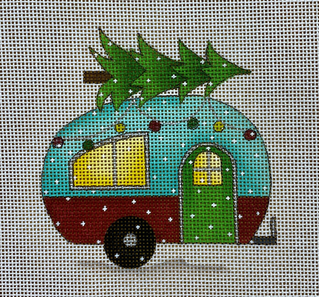 camper with christmas tree